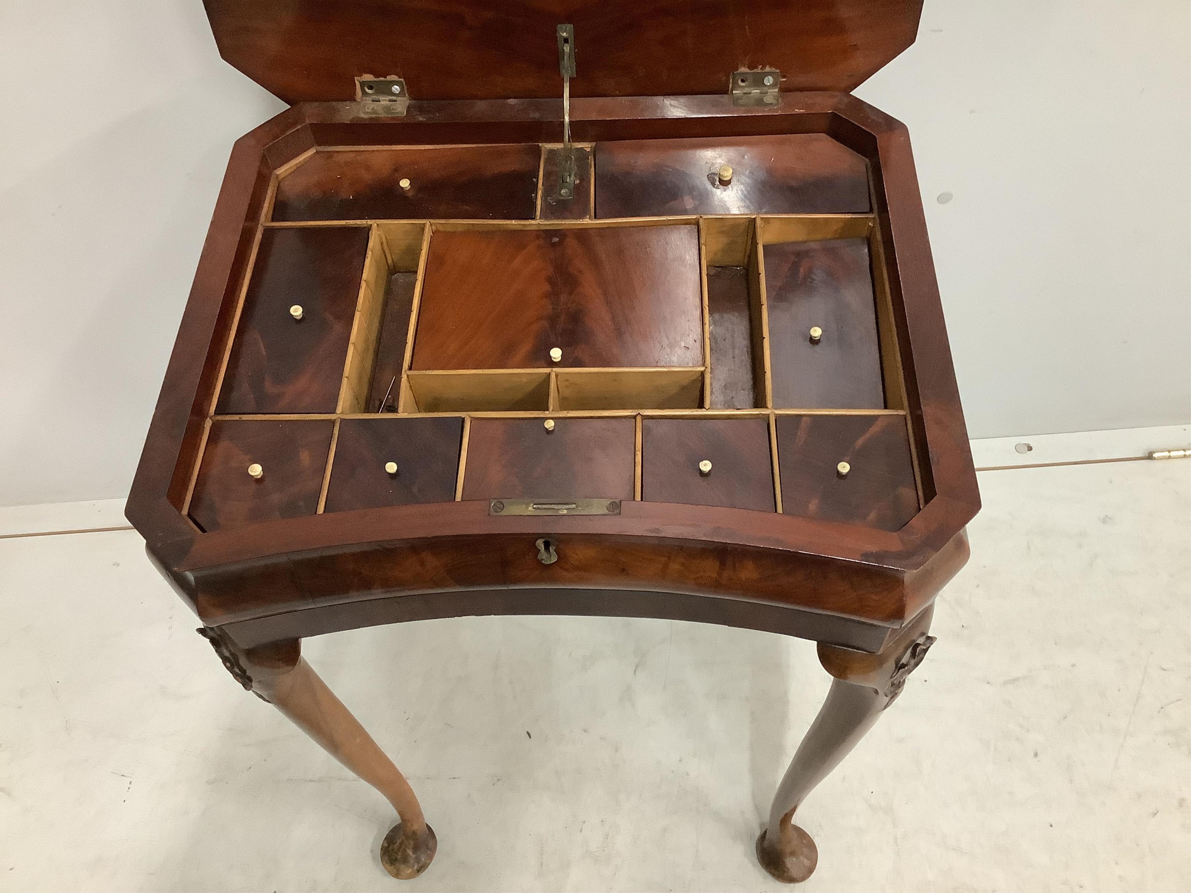 A Queen Anne Revival mahogany and beech concave front work table, width 50cm, depth 40cm, height 74cm. Condition - fair